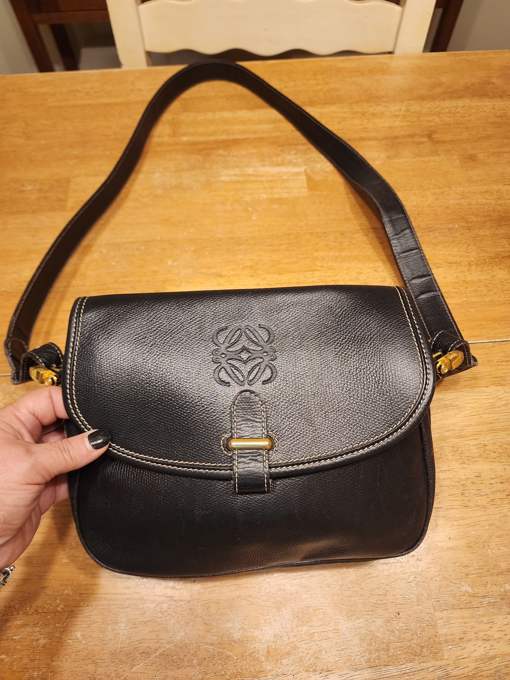 vintage black leather Loewe Anagram Crossbody Bag featuring gold-tone hardware